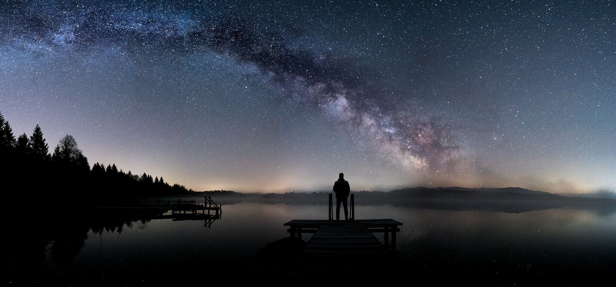 500px provided description: Nightwatch [#sky ,#lake ,#night ,#stars ,#sony ,#panorama ,#germany ,#long exposure ,#cosmos ,#milky way ,#astrophotography ,#bavaria ,#tranquility ,#galaxy ,#samyang ,#night photography ,#kirchsee ,#nightwatch ,#interstellar ,#a6300]