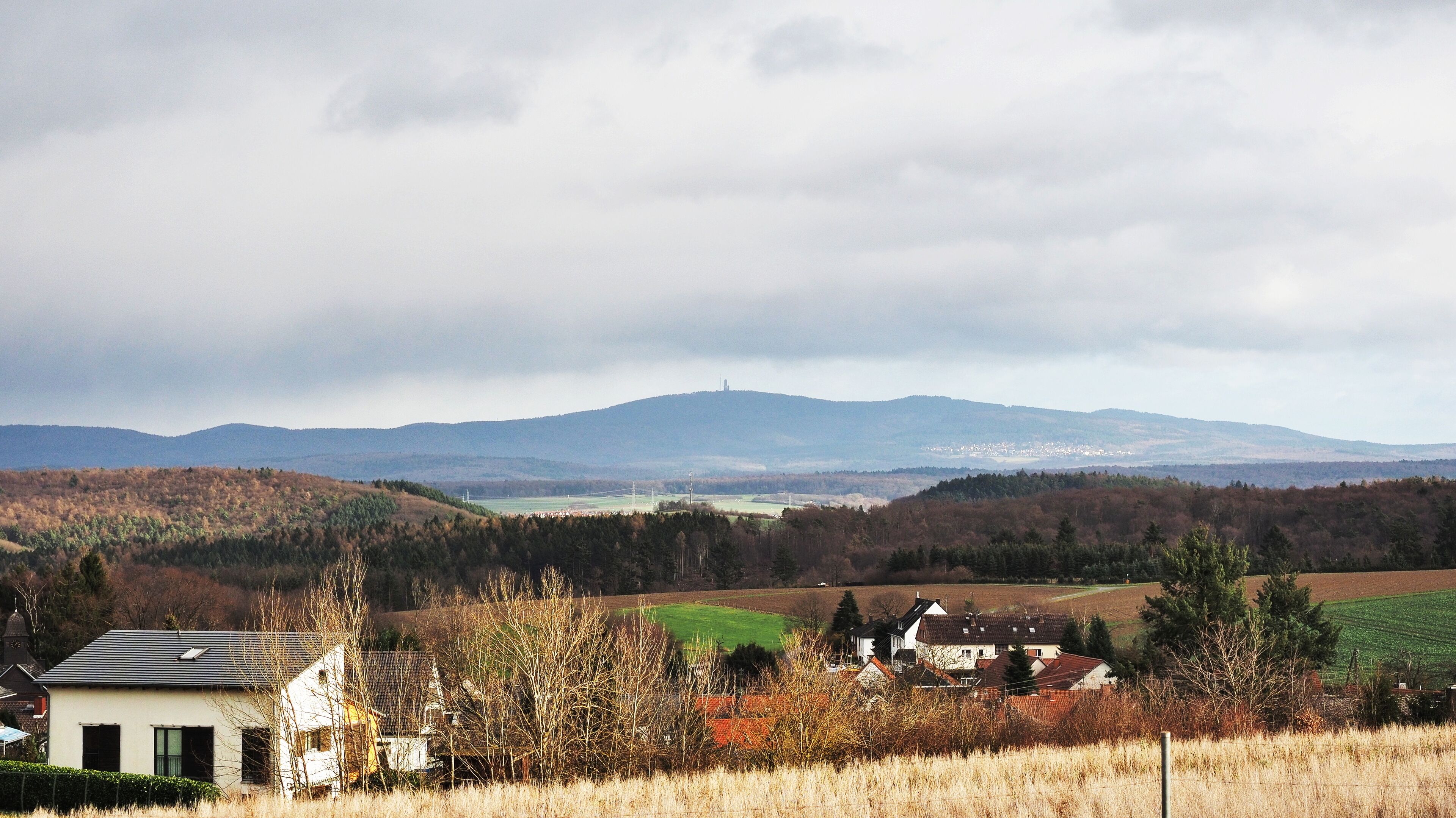 View towards Grosser Feldberg from Kesselbach, landscape and mountains without snow in January 2018, winter 2017-2018 in Germany.