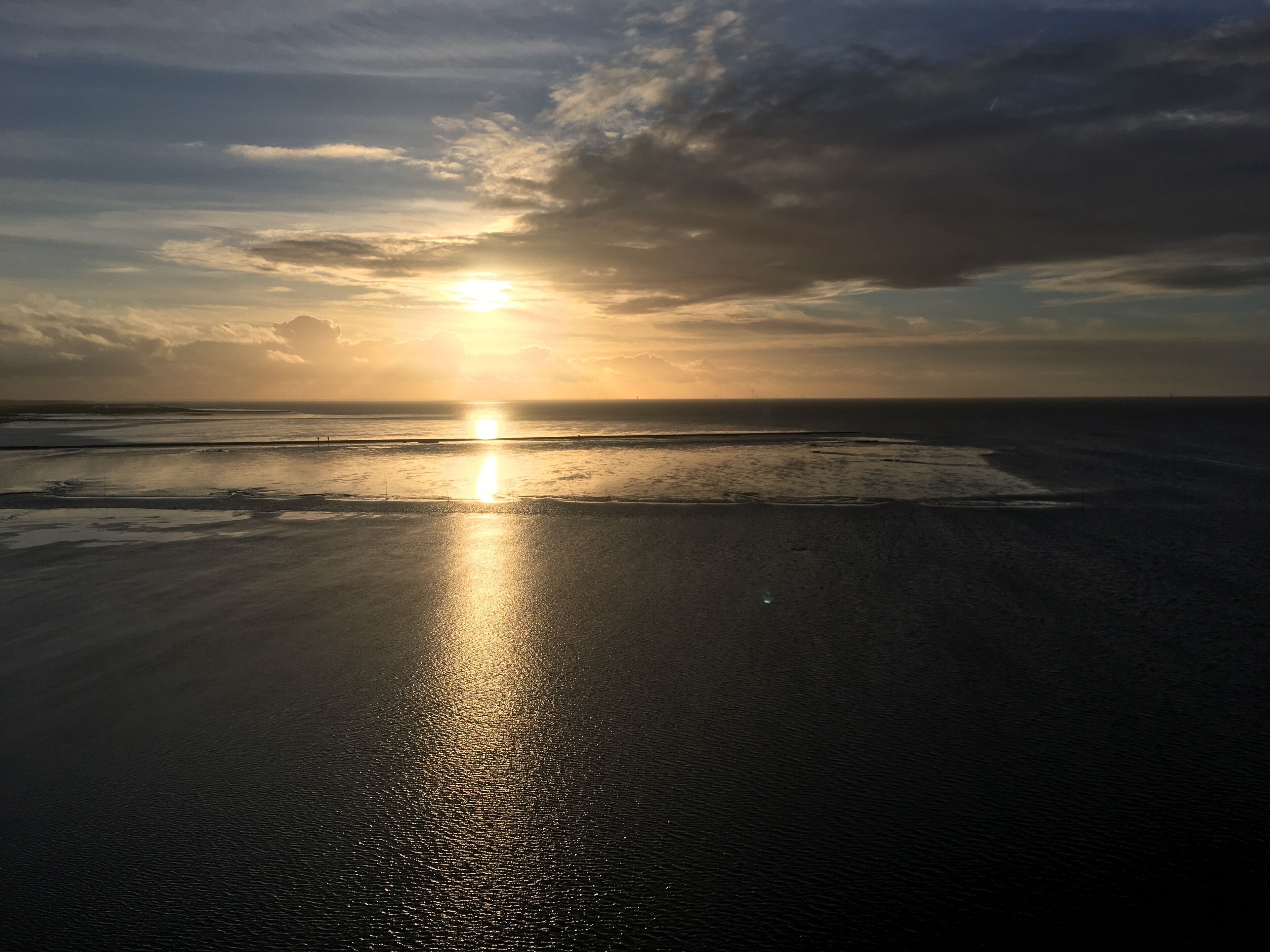Beatiuful picture taken on the lighthouse in dorum showing the sun an the mud flat while an ebb.