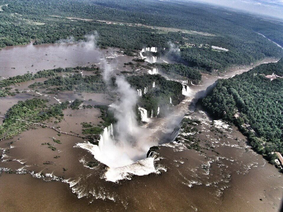 One of the top 3 falls in the world. Victoria, Iguacu and Niagara. Haven't been to Victoria yet but Iguacu trumps Niagara imho.

This one was taken from the helicopter. I came for it, I was impressed!

Source: Wikipedia 
Iguaçu National Park is a national park in Paraná State, Brazil.

Created by federal decree nr. 1035 of January 10, 1939, the Park comprises a total area of 185,262.5 hectares and a length of about 420 km, 300 km of which are natural borders by bodies of water and the Brazilian and Argentinean sides together comprise around 225 thousand hectares. The park shares with Iguazú National Park in Argentina one of the world’s largest and most impressive waterfalls, extending over some 2,700 m. It is home to many rare and endangered species of flora and fauna, among them the giant otter and the giant anteater. The clouds of spray produced by the waterfall are conducive to the growth of lush vegetation. It is a UNESCO World Heritage site.

#landscape #waterfalls #nature #nationalpark #bestof5