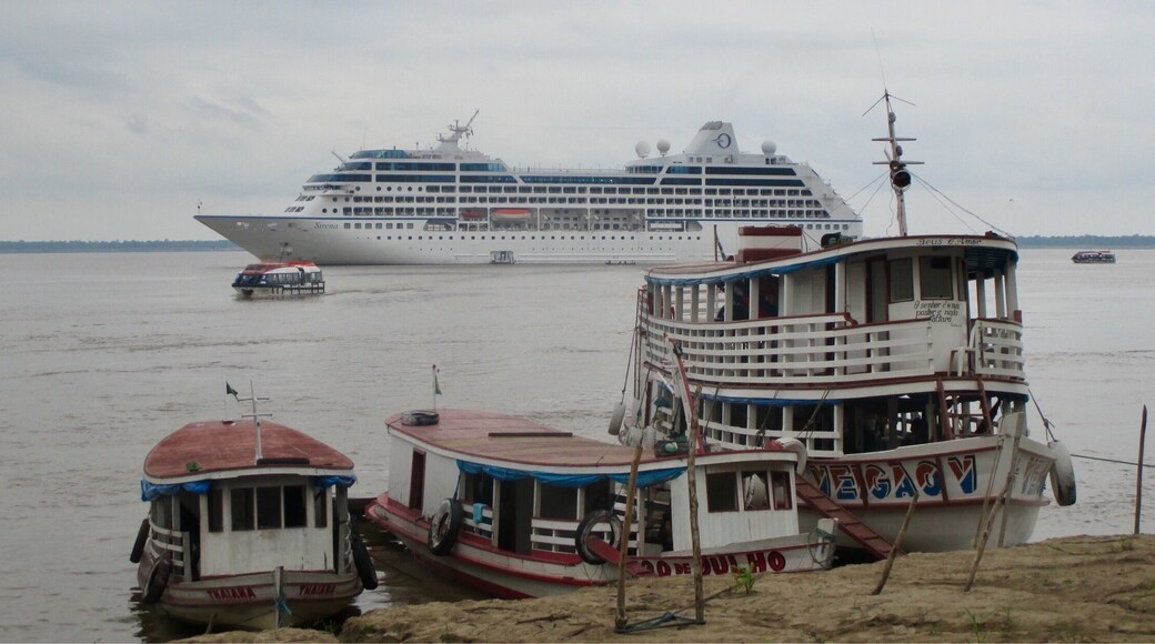 The river is used as a highway by the locals and you can see a wide variety of transportation options in the photo, including our home away from home.