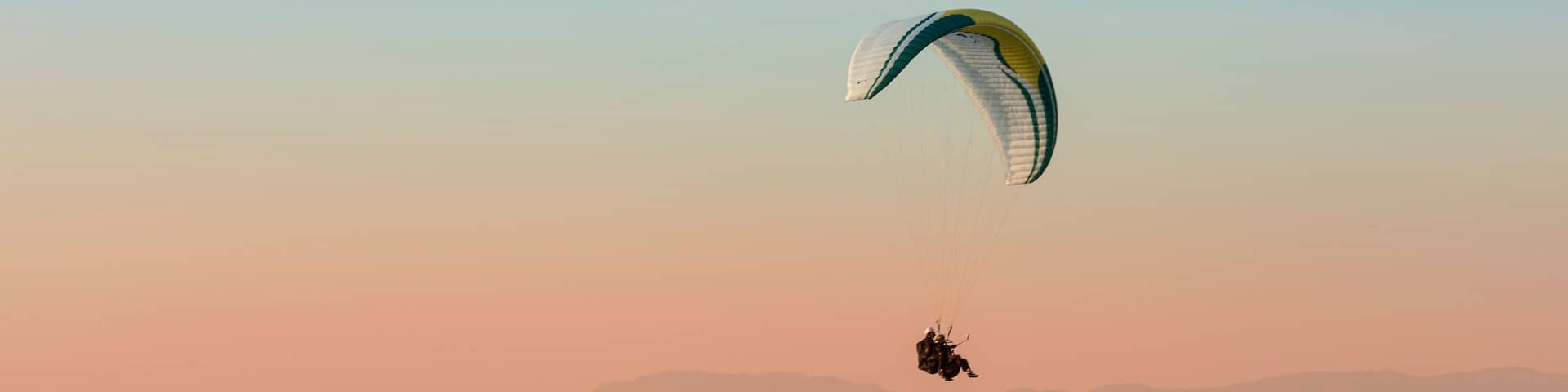 Pico do Gavião, Andradas, Minas Gerais, Brazil: sunset at the top of mantiqueira mountain with paraglaider flight