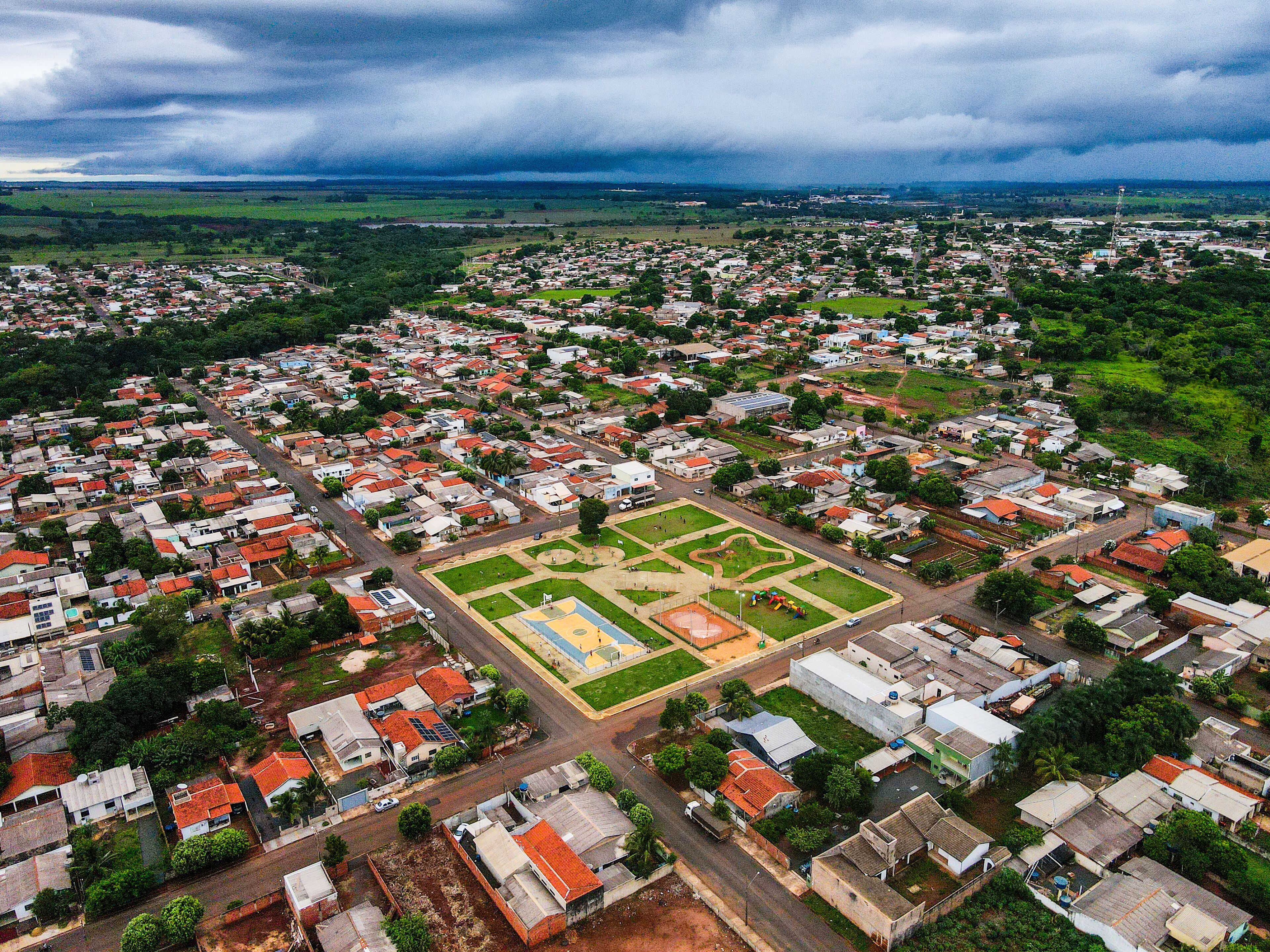 An aerial view of a densely populated town with a central square and surrounding residential areas.