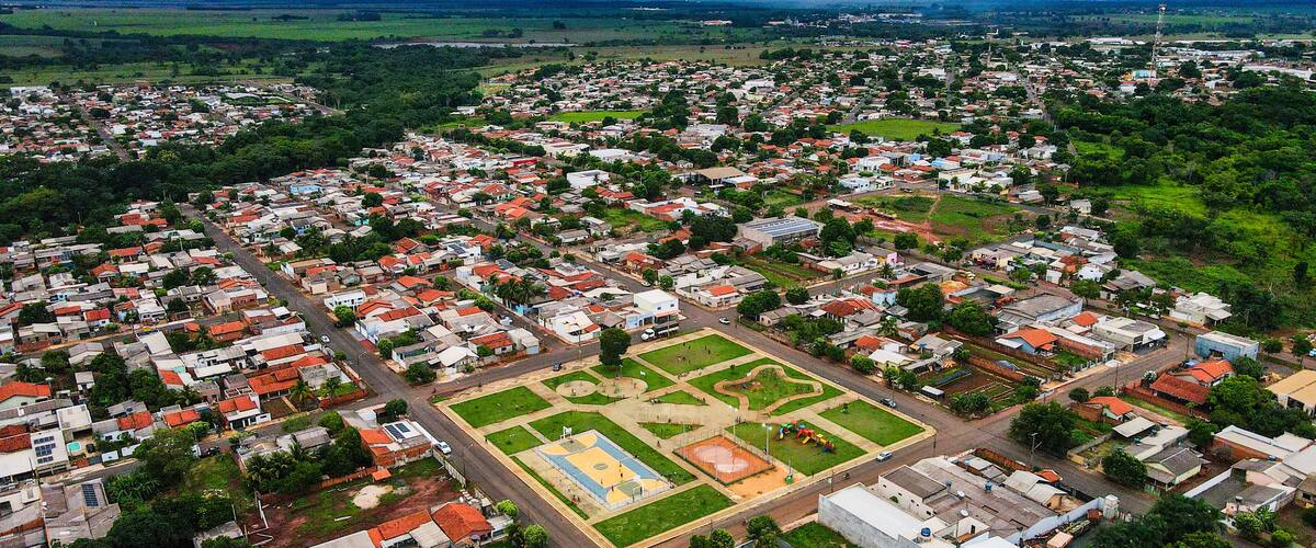 An aerial view of a densely populated town with a central square and surrounding residential areas.