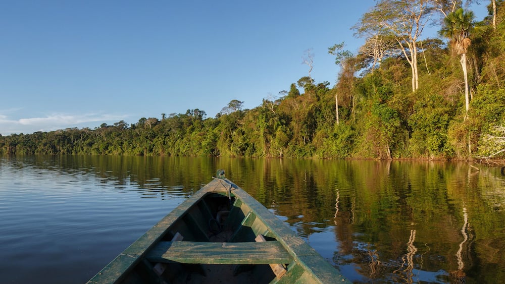 Canoe in the amazon forest, Peru.
