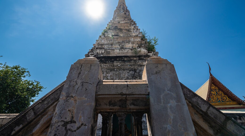 The old pagoda at Wat Klang Khlong Watthanaram, or Wat Muang, in Sena, Ayutthaya, is famed for its vibrant purple ordination hall and intricate decorations, making it a notable landmark in the area.