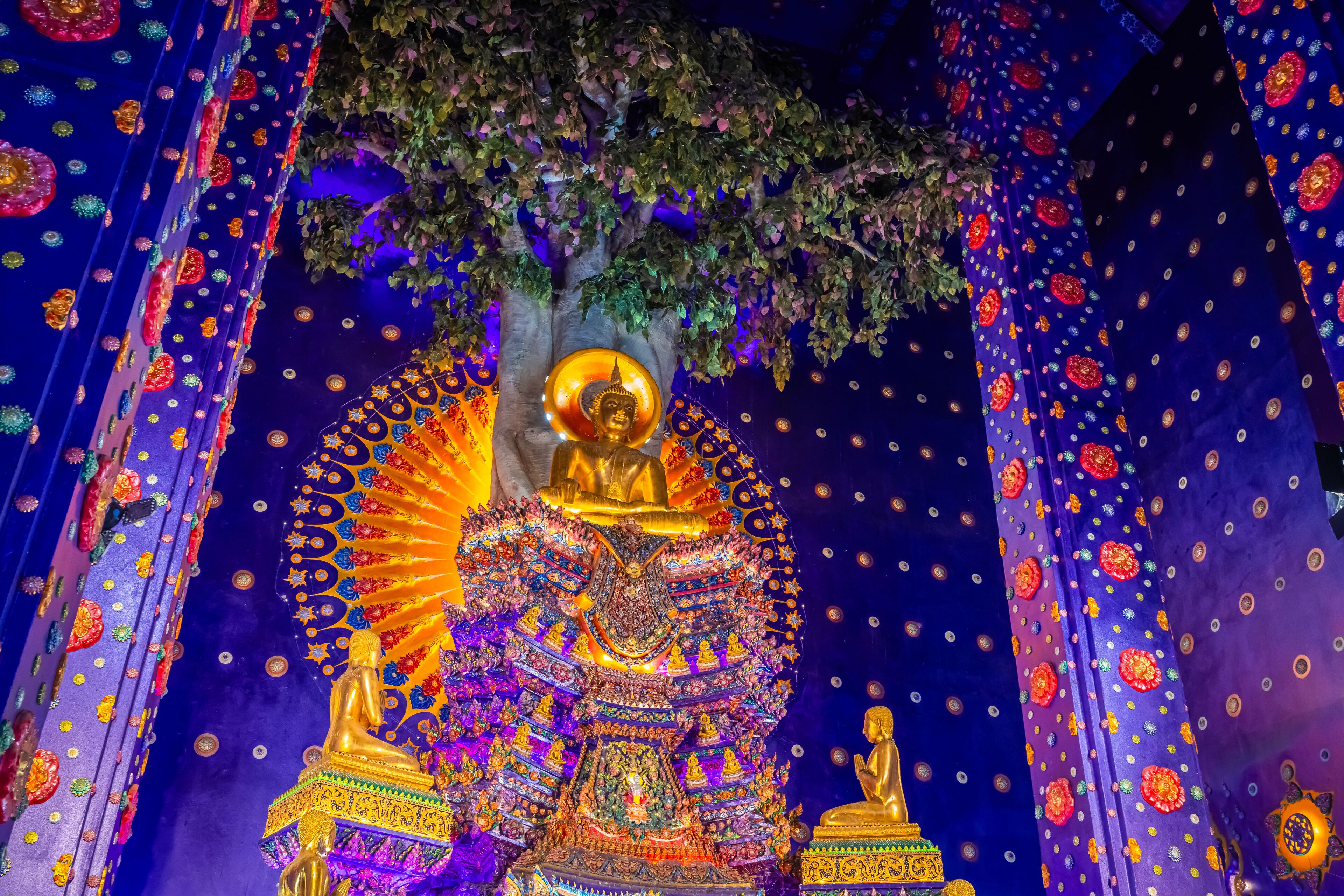 Wat Klang Khlong Watthanaram, or Wat Muang, in Sena, Ayutthaya, is famed for its vibrant purple ordination hall and intricate decorations, making it a notable landmark in the area.