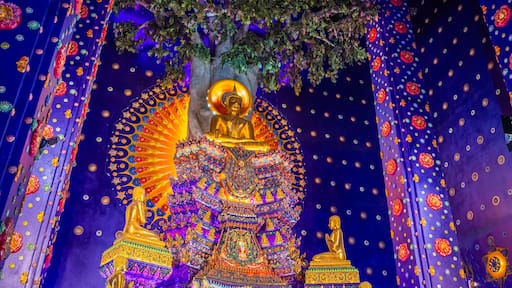 Wat Klang Khlong Watthanaram, or Wat Muang, in Sena, Ayutthaya, is famed for its vibrant purple ordination hall and intricate decorations, making it a notable landmark in the area.