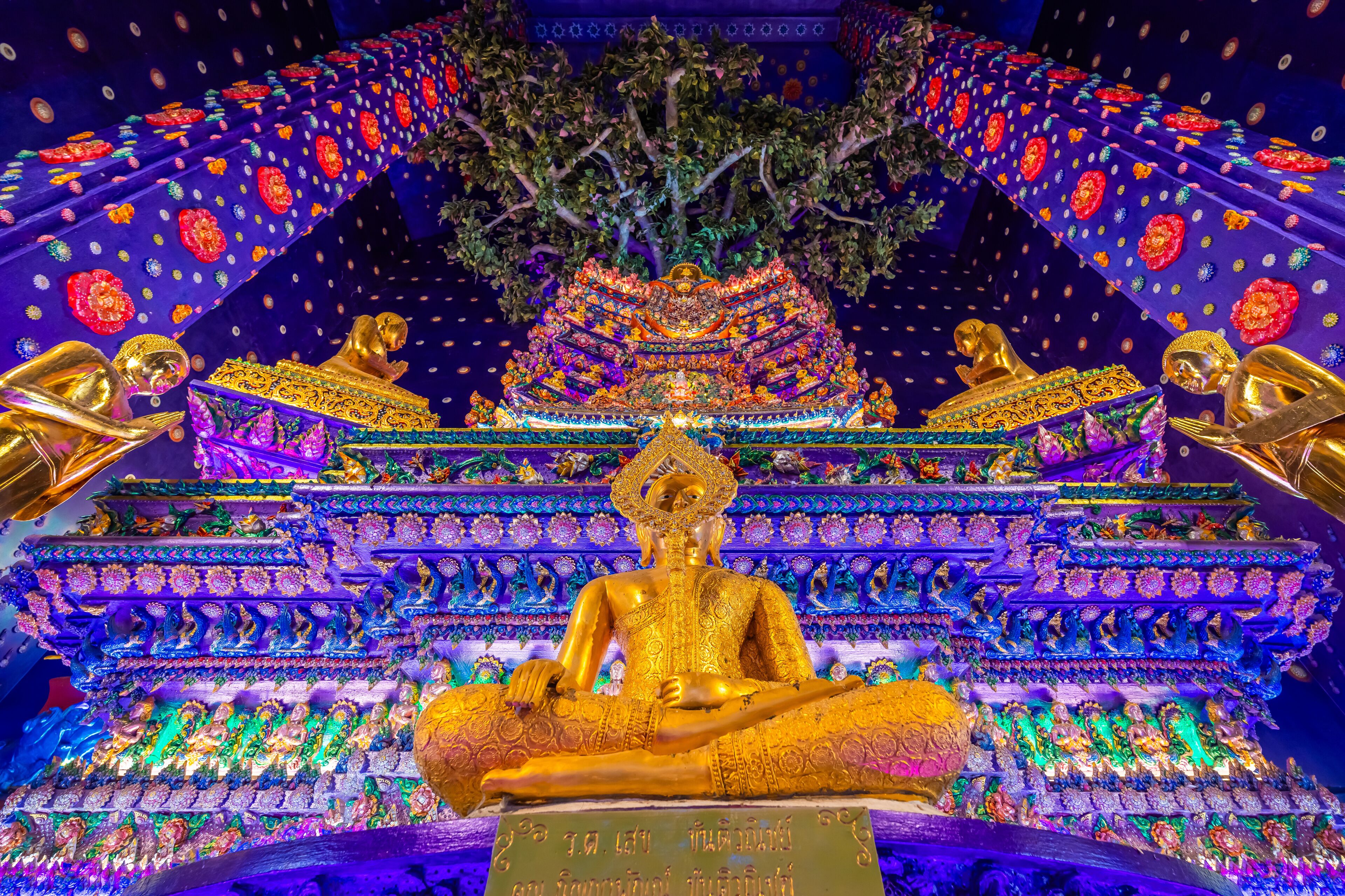 Wat Klang Khlong Watthanaram, or Wat Muang, in Sena, Ayutthaya, is famed for its vibrant purple ordination hall and intricate decorations, making it a notable landmark in the area.