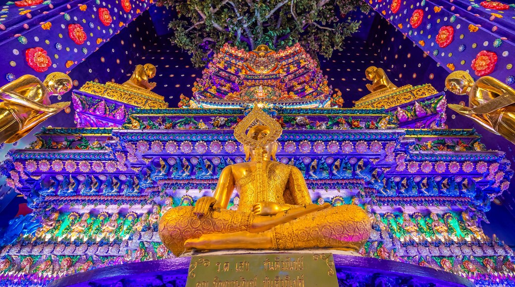 Wat Klang Khlong Watthanaram, or Wat Muang, in Sena, Ayutthaya, is famed for its vibrant purple ordination hall and intricate decorations, making it a notable landmark in the area.
