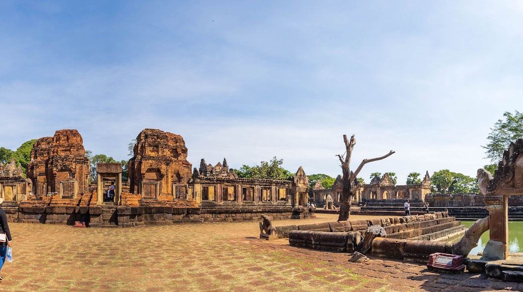 BURIRAM, THAILAND - December 4, 2021: Tourists visit the Khmer archaeological site of Prasat Muang Tam, Buriram Province, Thailand.