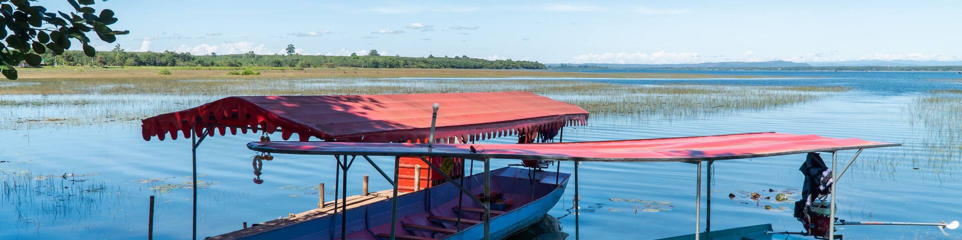 boats serving tourists.The water,the swamp,fog,the mountain,the beautiful sky and cloud at Bueng Khong Long,Seka district,Bung Kan province,Thailand.