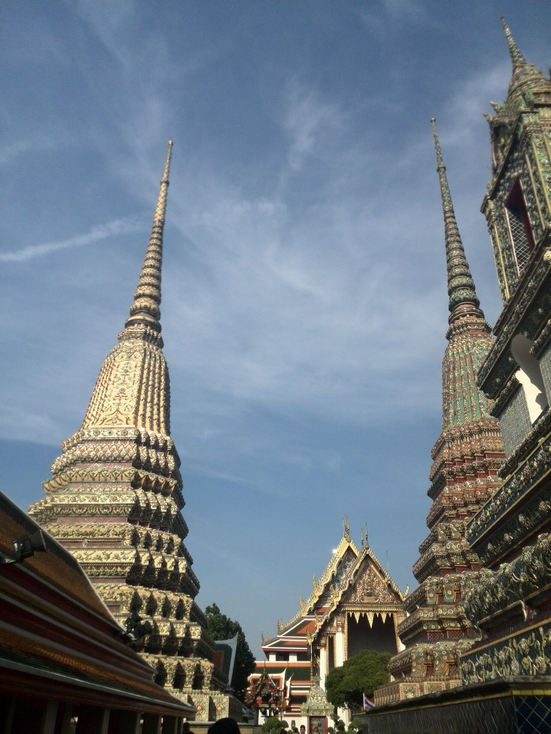 Ornate temple spires with intricate designs against a clear sky.