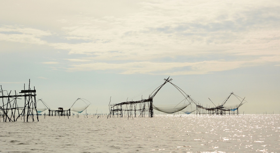 Fishing nets silhouettes at Thale Luang. Upper Songkhla lake. Phatthalung province. Thailand