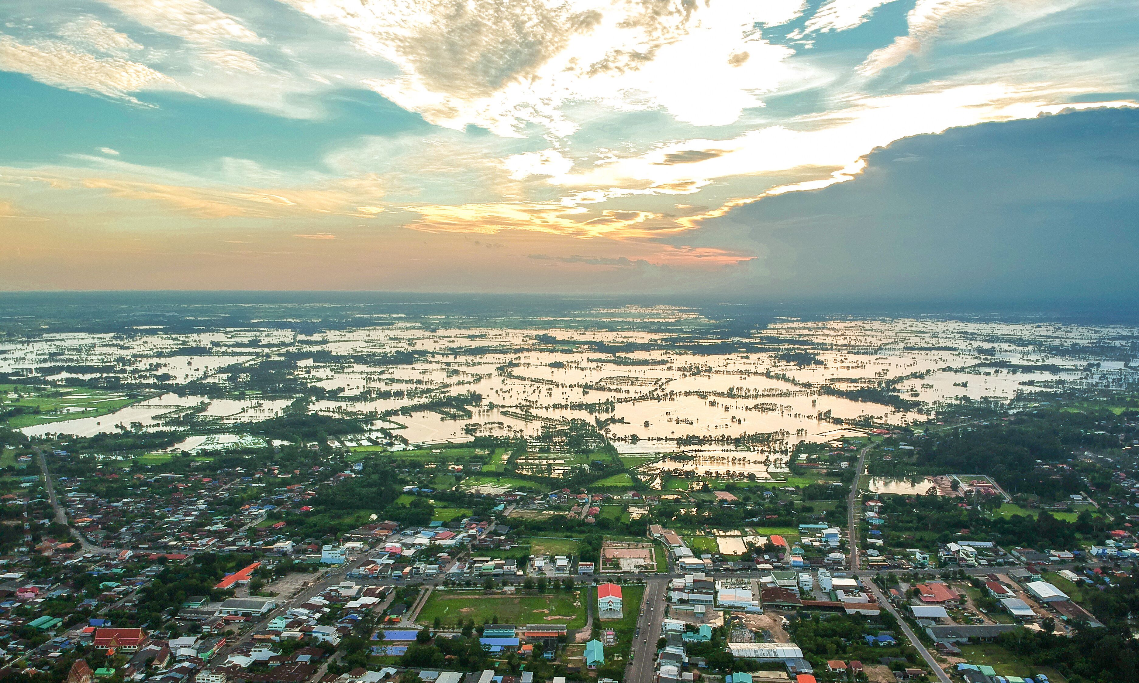 Aerial photo of small town and flood, Kasetwisai town, Roiet city Thailand