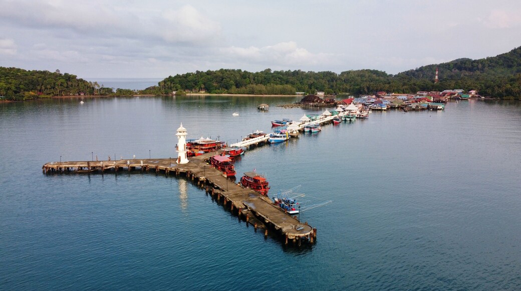 High angle view of Bang Bao Pier in the morning at Ko Chang District, Trat. There is a white lighthouse at the end of the marina.