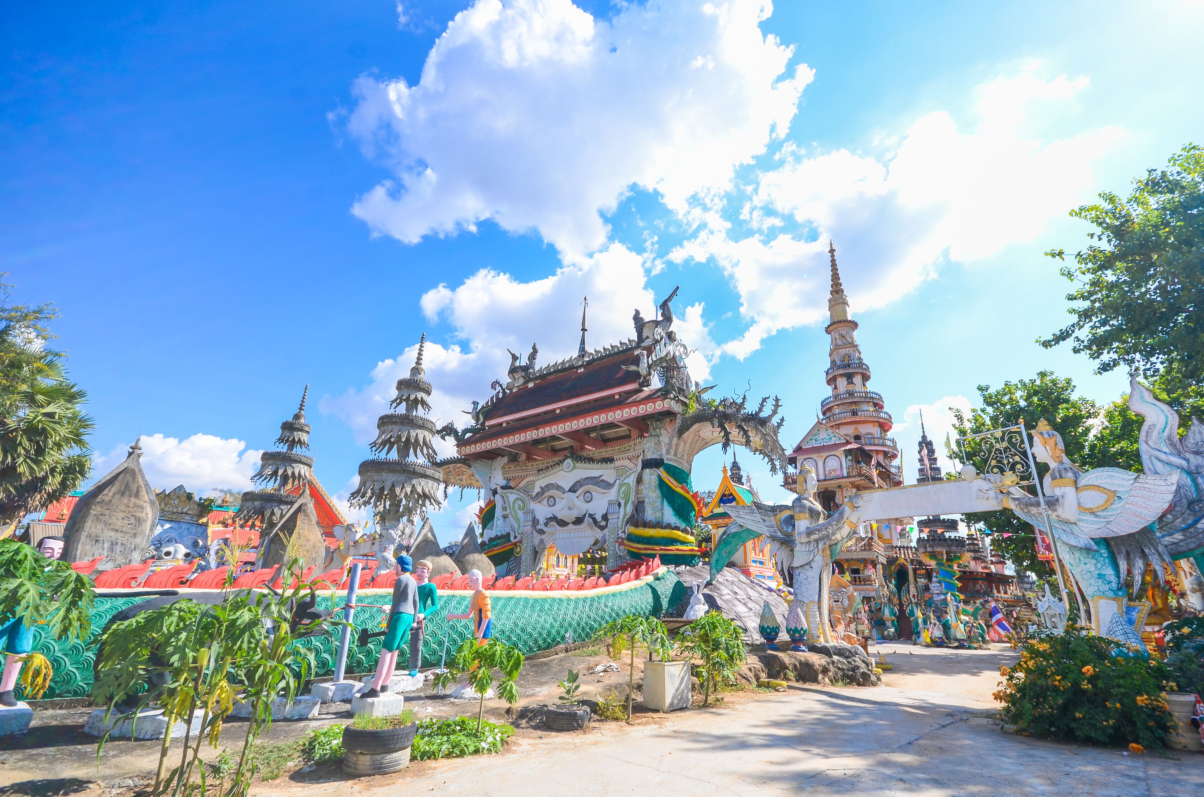 A colorful temple complex with ornate architecture and multiple spires.