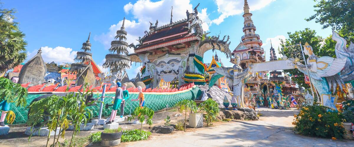 A colorful temple complex with ornate architecture and multiple spires.