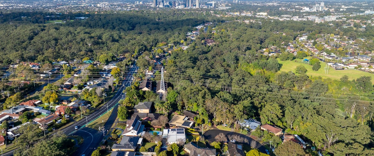 Drone aerial photograph of houses and the general landscape and precinct heading towards to the city of Parramatta in the greater Sydney region of New South Wales in Australia.