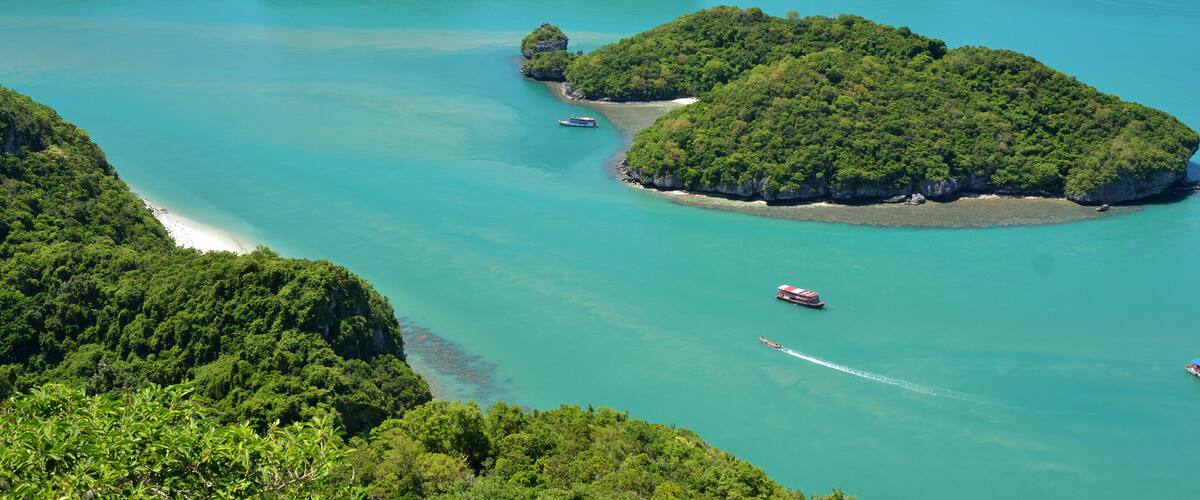 A coastal landscape with numerous small islands surrounded by turquoise waters.