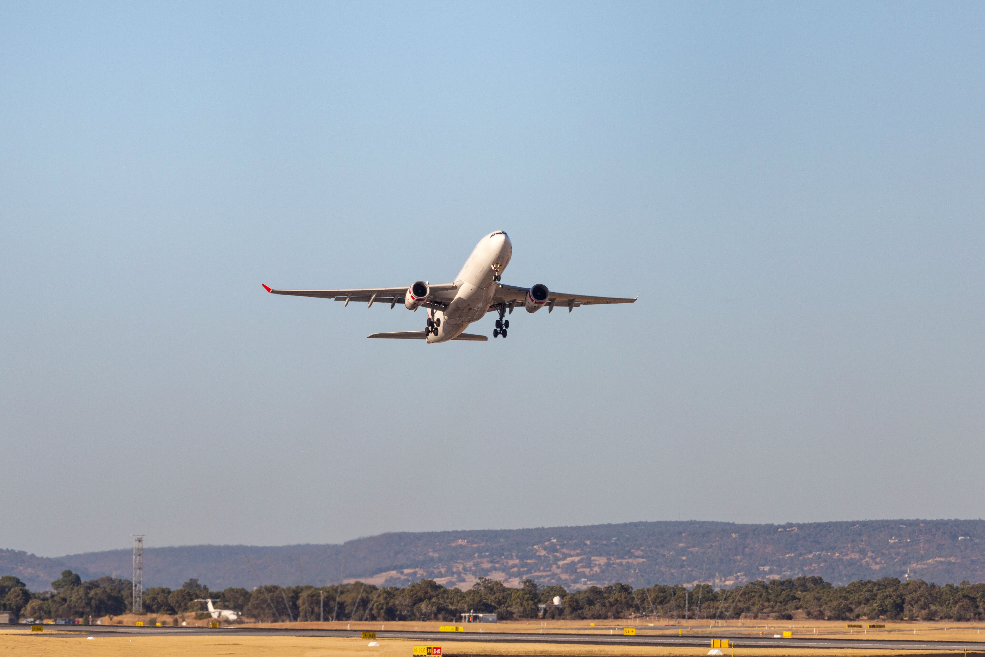 plane flying in the blue sky