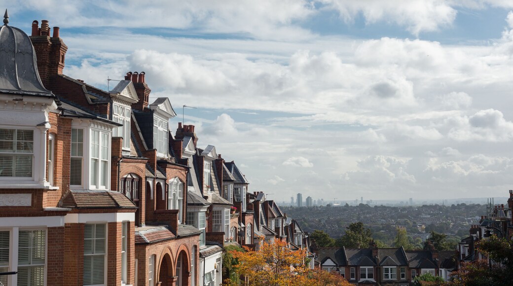 Brick houses of Muswell Hill and panorama of London with Canary Wharf, London, UK