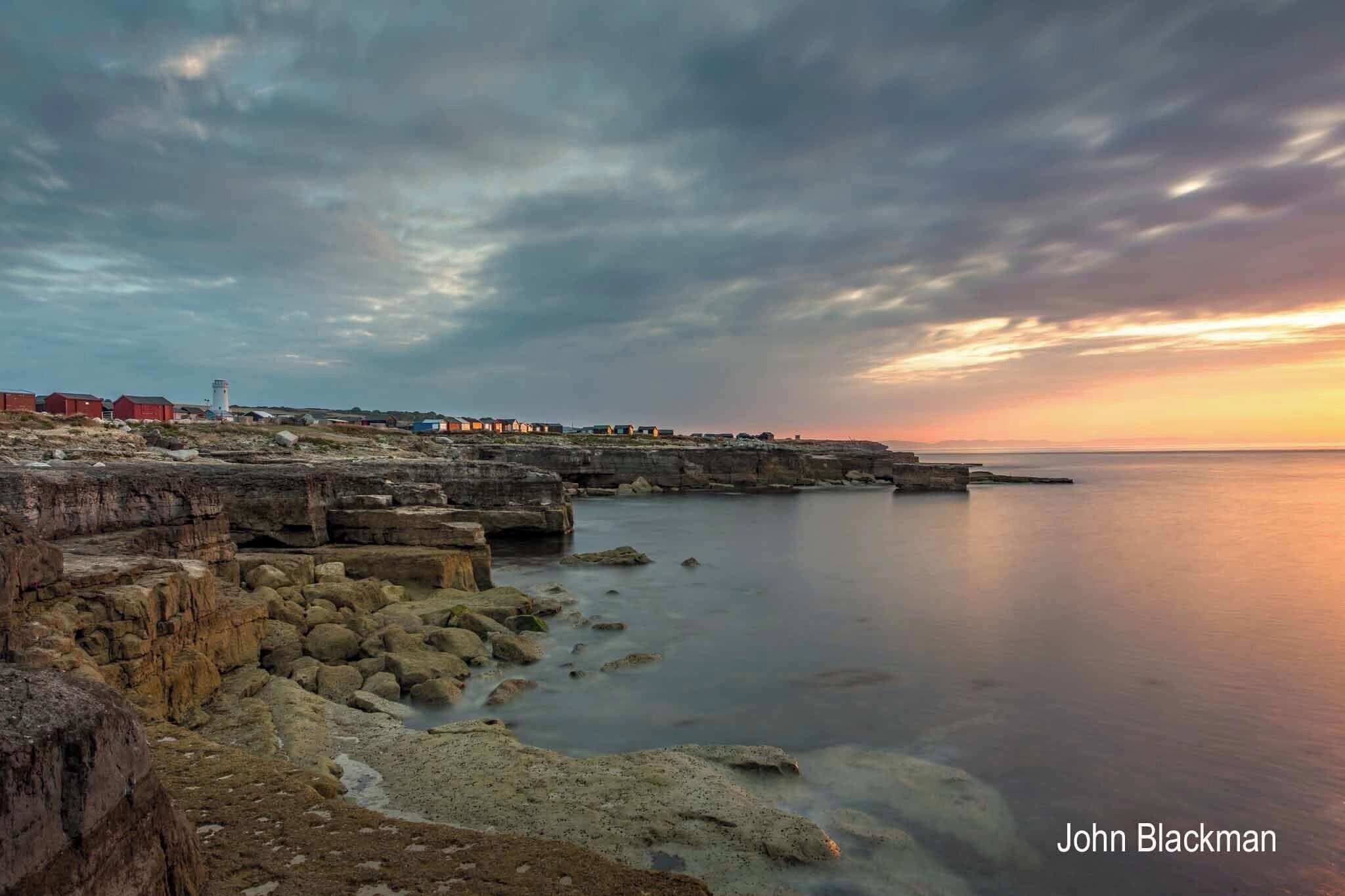 Turn away from Portland Bill lighthouse and this is the view. The beach huts are arguably an eyesore but at least have caught the early morning light.