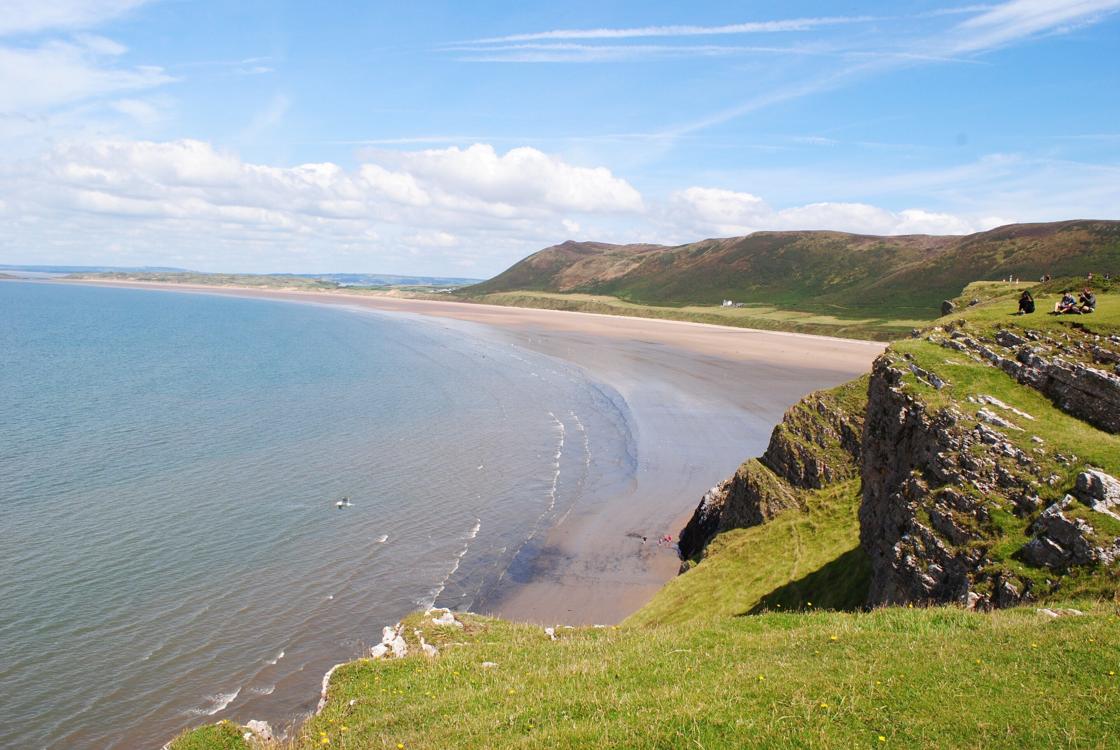 Rhossili is located at the most Western part of the Gower Peninsula. The most photographed part of Gower, The Worms Head, stretches out to sea and becomes an island when the tide comes in. The breathtaking view is completed by the long sandy beach and the towering cliffs and this makes it a popular destination throughout the year with surfers, paragliders and ramblers. However, Rhossili still manages to maintain its tranquility and unspoilt beauty.
#BeachTips