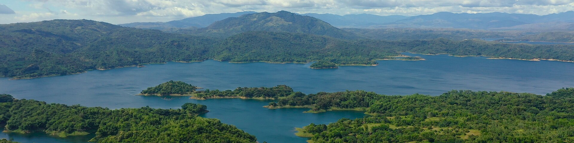 Beautiful landscape with green hills, top view. Azure Pantabangan lake among the hills. Lake in the mountains. Philippines, Luzon.