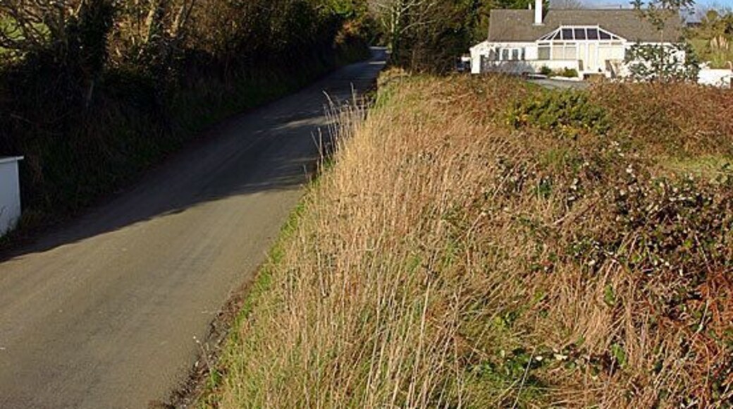 Ballacomish. Hardly a hamlet, just a scattering of houses. The photo is taken looking north up the B42.