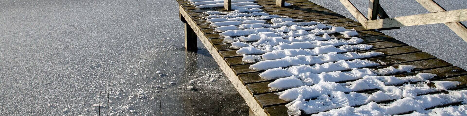 Lake at Ballannette A wetland nature reserve, open to the public (but not their cars) and created by Stuart Clague.