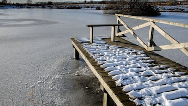 Lake at Ballannette A wetland nature reserve, open to the public (but not their cars) and created by Stuart Clague.