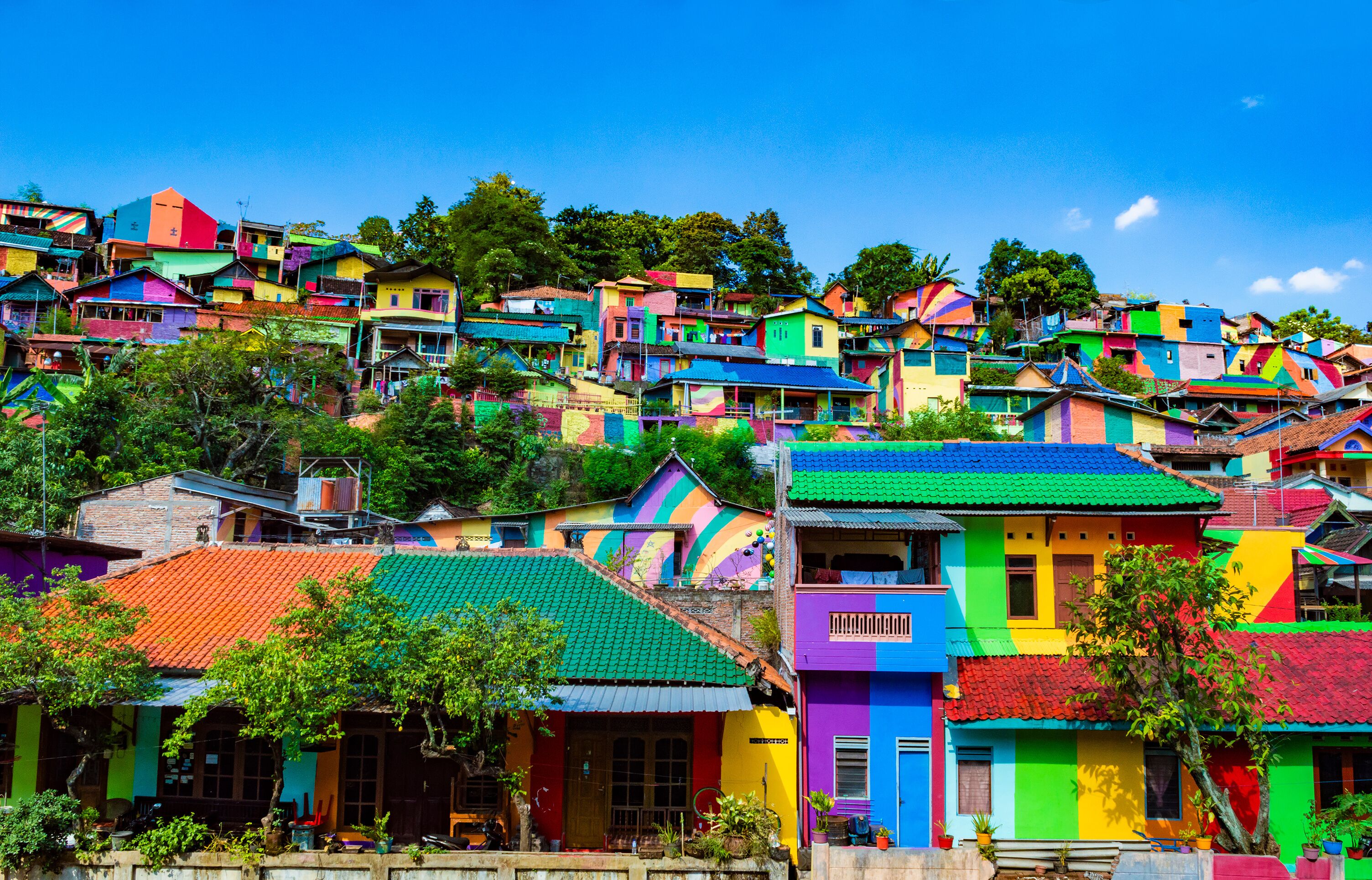 Semarang, Indonesia - 27th May 2017: Colorful houses in Kalisari Rainbow Village (Kampung Pelangi Kalisari) in Semarang, Indonesia. The writing translates to Rainbow Village Wonosari City