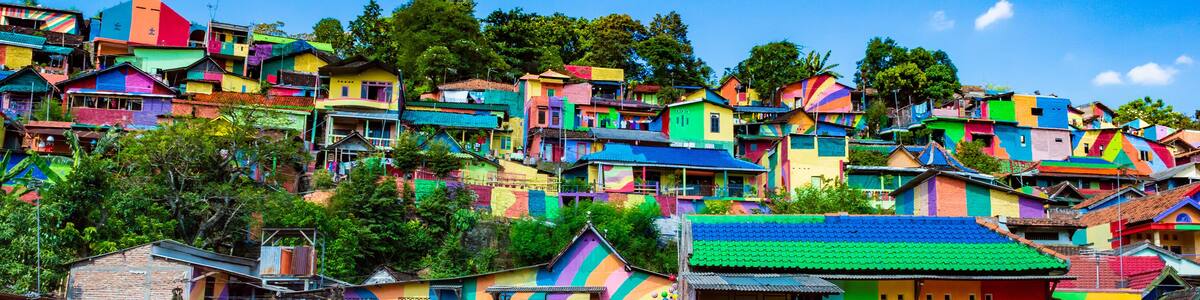 Semarang, Indonesia - 27th May 2017: Colorful houses in Kalisari Rainbow Village (Kampung Pelangi Kalisari) in Semarang, Indonesia. The writing translates to Rainbow Village Wonosari City