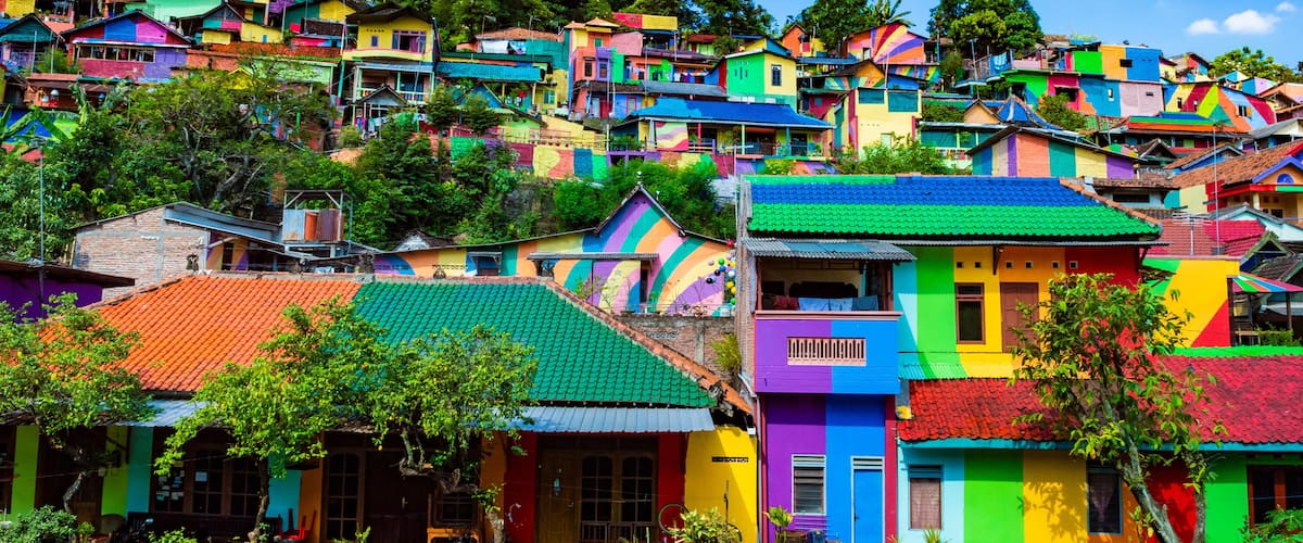 Semarang, Indonesia - 27th May 2017: Colorful houses in Kalisari Rainbow Village (Kampung Pelangi Kalisari) in Semarang, Indonesia. The writing translates to Rainbow Village Wonosari City
