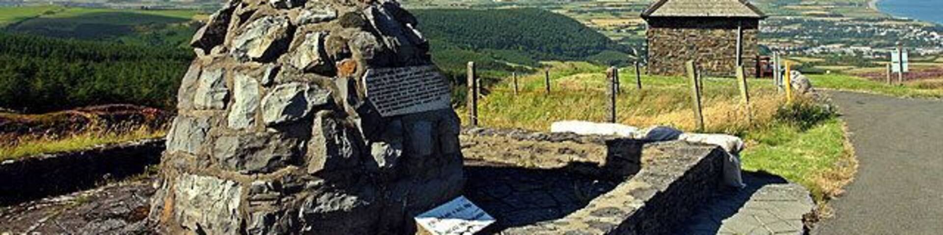 Guthrie's Memorial. On the TT course, high above Ramsey (in the background).