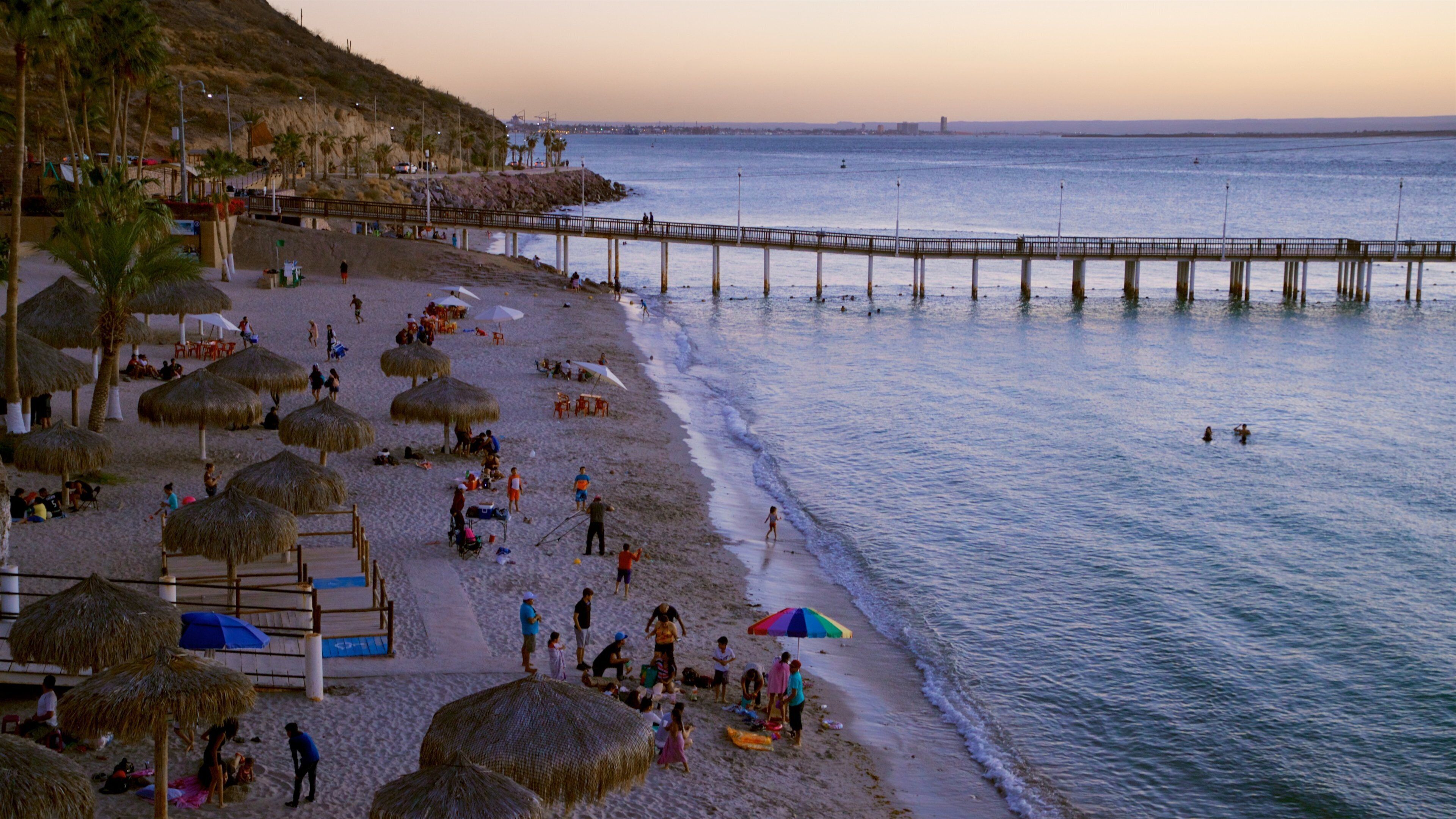 Playa El Coromuel featuring a sandy beach, general coastal views and a sunset