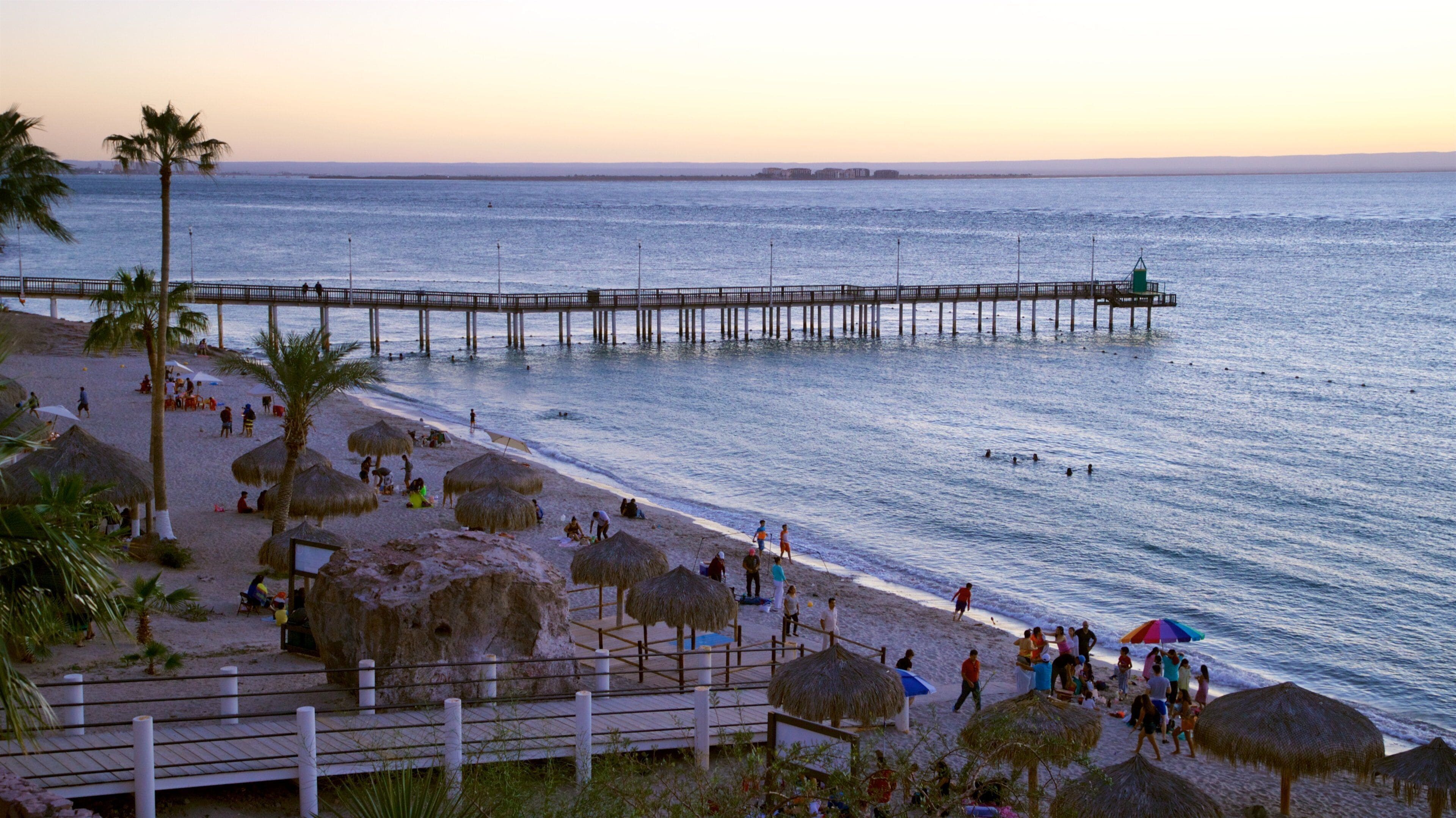 Playa El Coromuel featuring a sunset and general coastal views