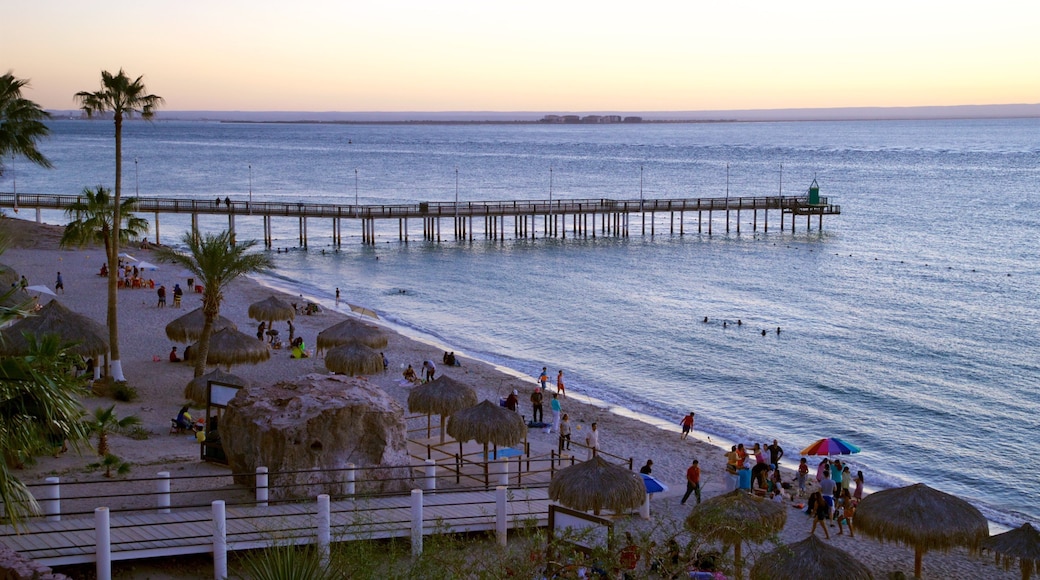 Playa El Coromuel featuring a sunset and general coastal views