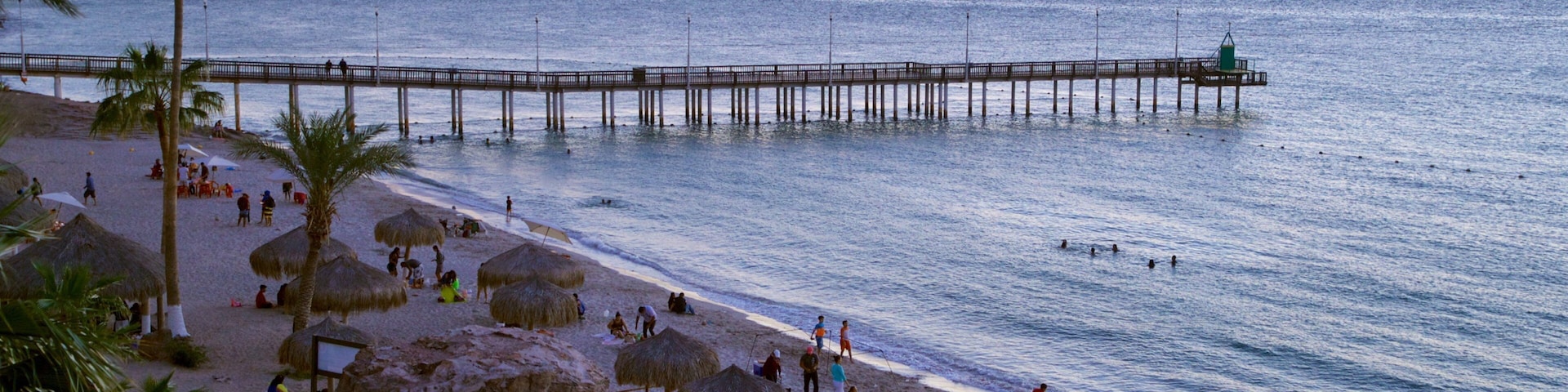 Playa El Coromuel featuring a sunset and general coastal views
