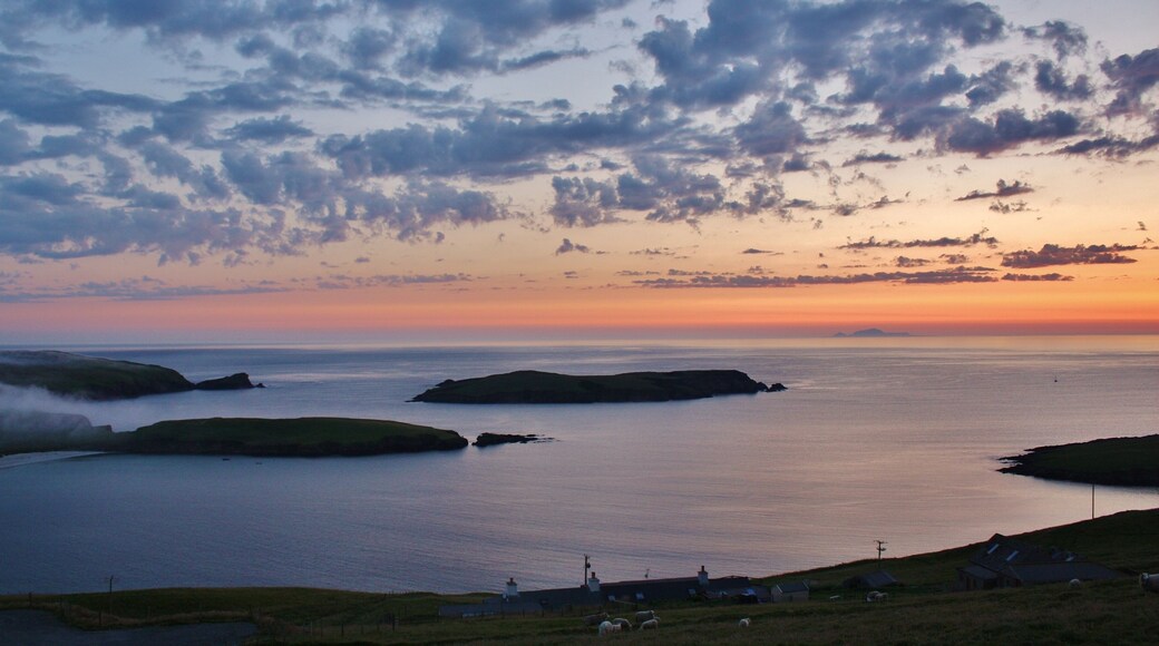 Looking out over the the small island of Colsa and distant Foula.