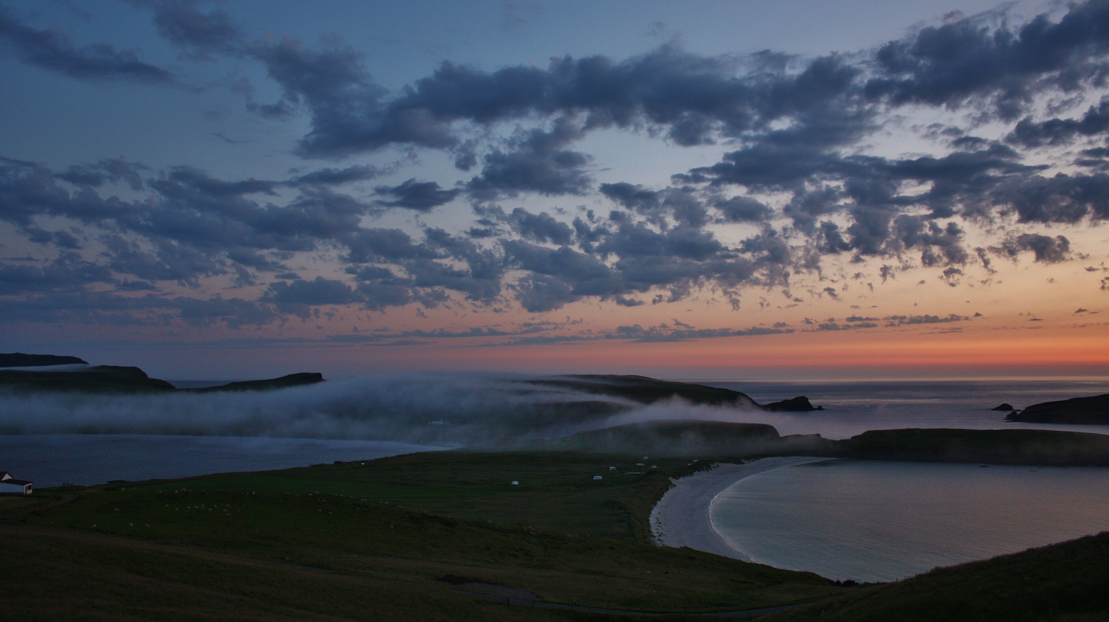 with the mist rolling across and obscuring Spiggie loch.