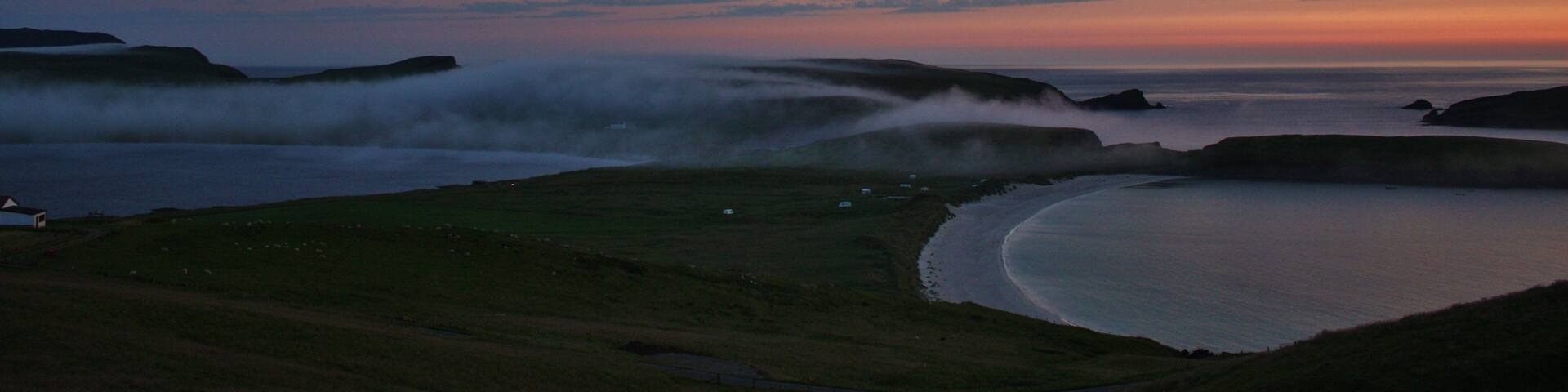 with the mist rolling across and obscuring Spiggie loch.