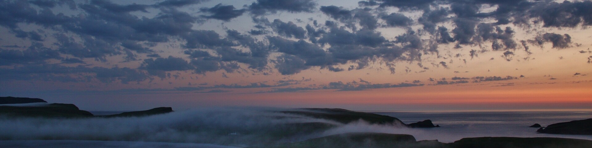 with the mist rolling across and obscuring Spiggie loch.