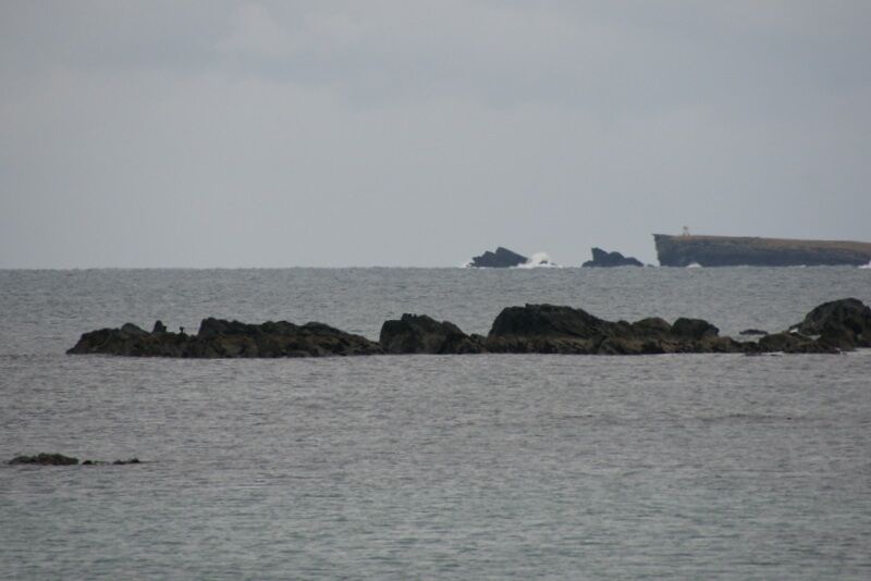 Longa Skerry, Cunningsburgh The small lighthouse on the Peerie Bard of Mousa is in the distance.