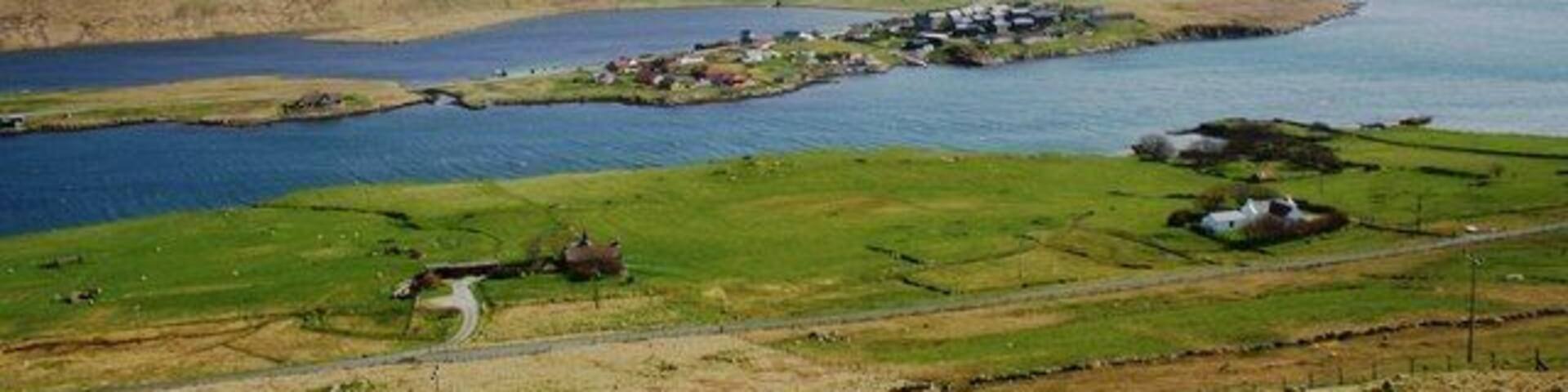 Hellister across Weisdale Voe The Loch of Hellister with Weisdale Voe in the foreground, the intersection f the two is crossed by the Kallie Bridge.