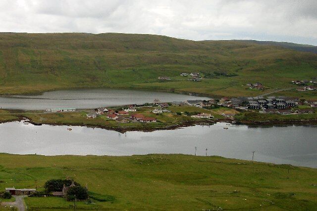 Kalliness. The village seen across the waters of Weisdale Voe