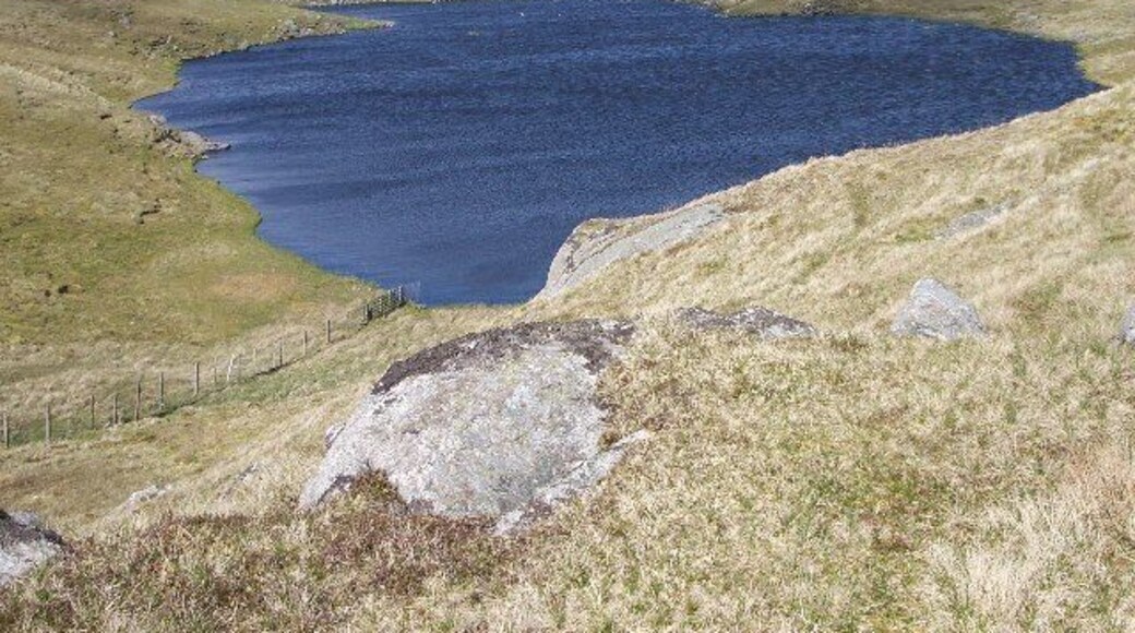 Mill Loch, Lunna Ness. This is one of a group of three lochans to the west of Grutwick. They are surrounded by the rocky hills which make up the spine of this peninsula,