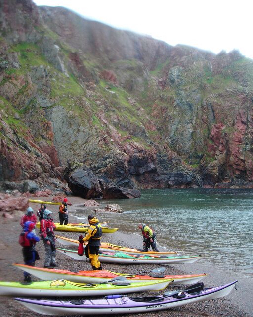 Beach below the Cupps, Ronas Voe Rain and very strong winds made this an interesting trip in the shelter of the cliffs in Ronas Voe. After crossing from the NE side to this beach on the SW side with a crosswind and some rough water, we took a well-deserved lunch break on this beach with red granite shingle from the eroded cliffs which were providing limited shelter from the weather.