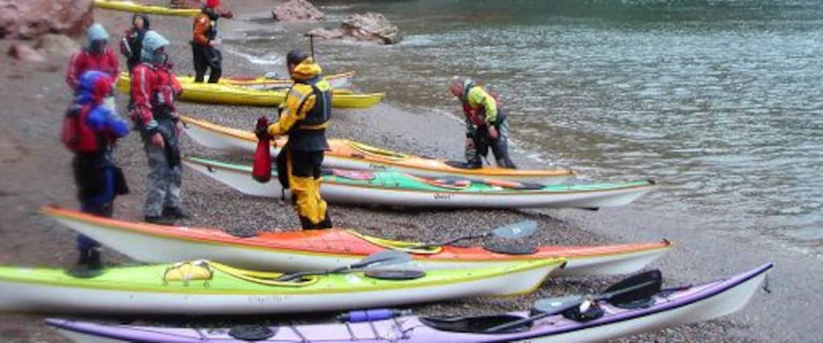 Beach below the Cupps, Ronas Voe Rain and very strong winds made this an interesting trip in the shelter of the cliffs in Ronas Voe. After crossing from the NE side to this beach on the SW side with a crosswind and some rough water, we took a well-deserved lunch break on this beach with red granite shingle from the eroded cliffs which were providing limited shelter from the weather.